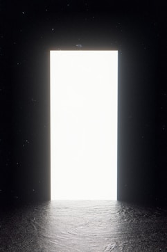 a large open door in a dark room