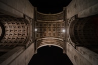 A panoramic view of an international assembly of Masonic leaders standing united beneath a grand vaulted ceiling.