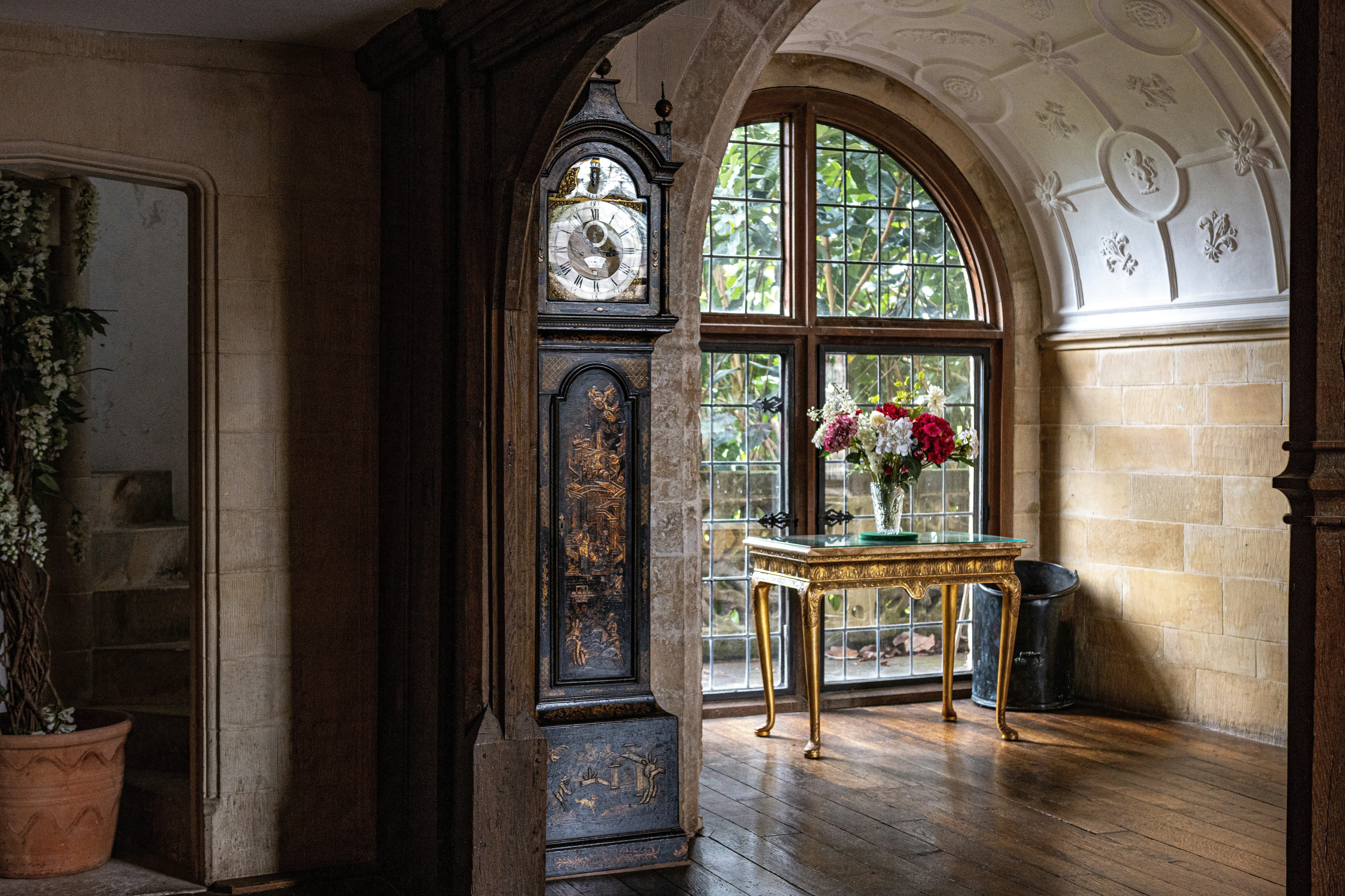 a room with a table and a large window