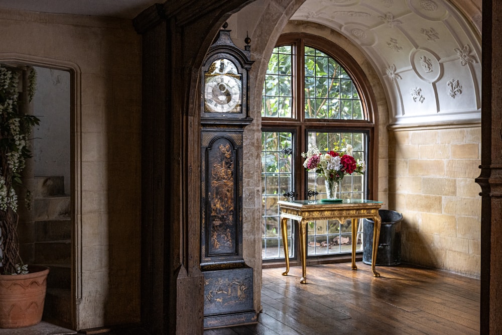 a room with a table and a large window