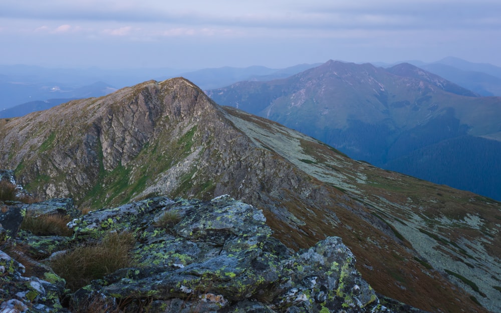 a view of the mountains from the top of a mountain