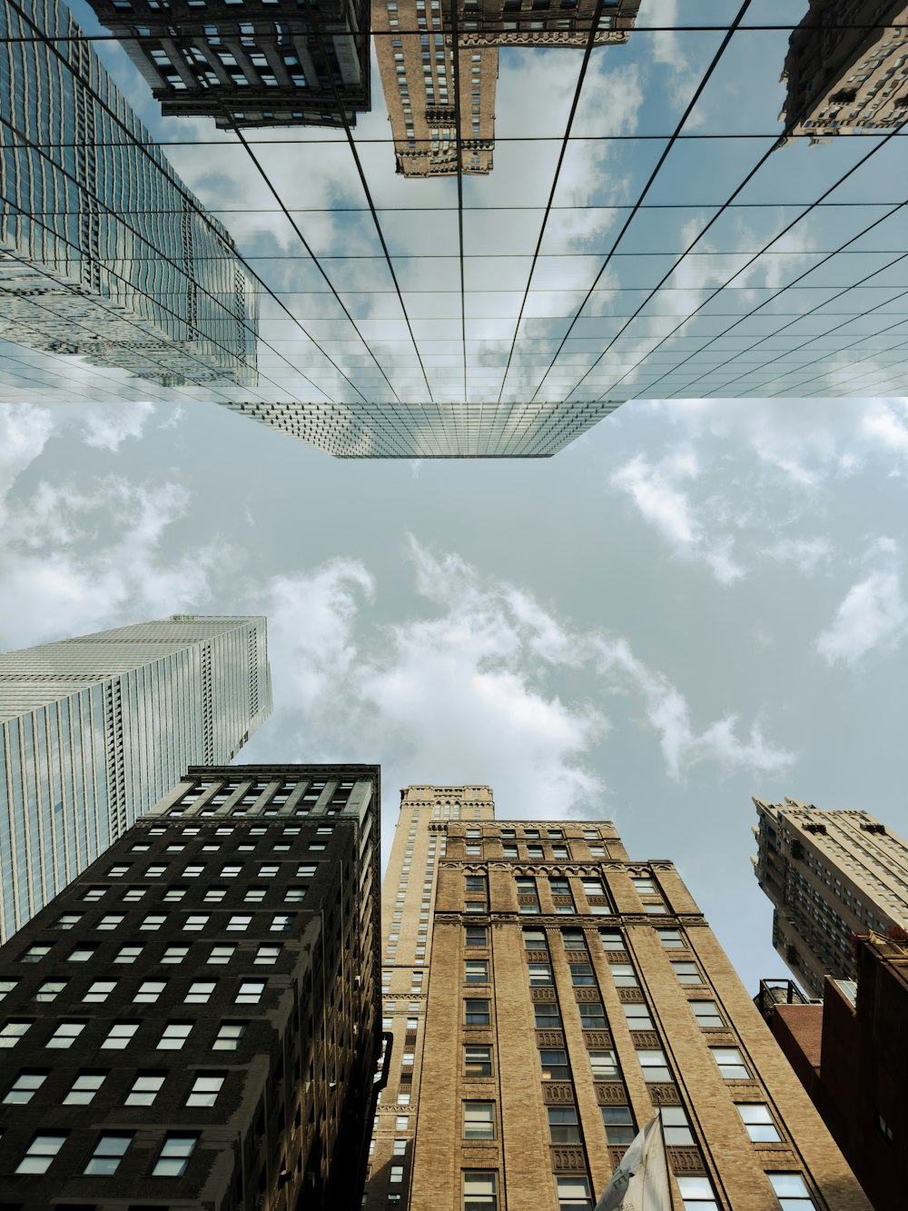 looking up at tall buildings in a city