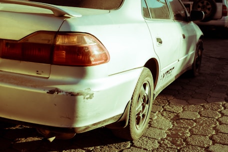 a white car parked on the side of the road
