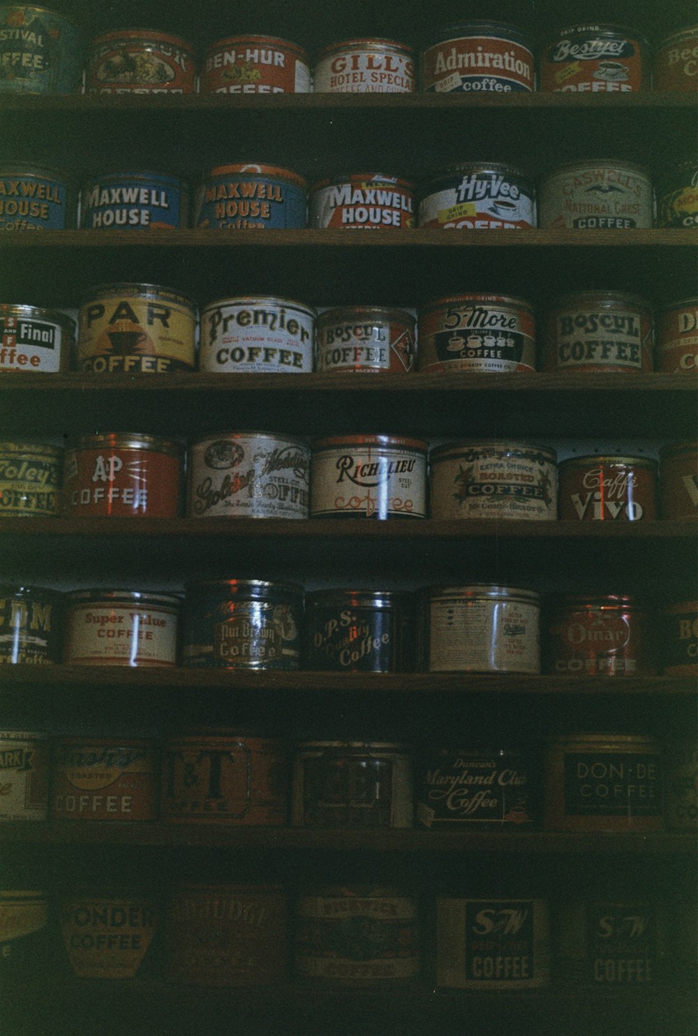 a shelf filled with lots of different types of coffee