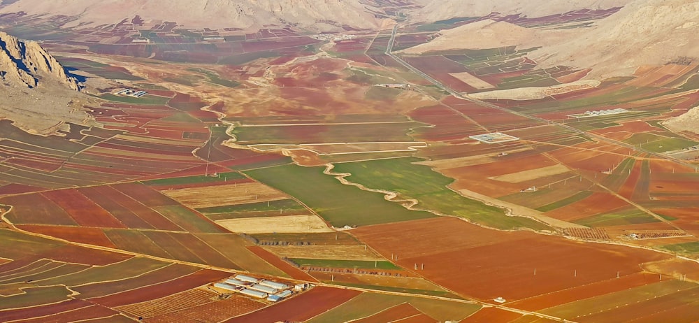 an aerial view of a valley with a river running through it