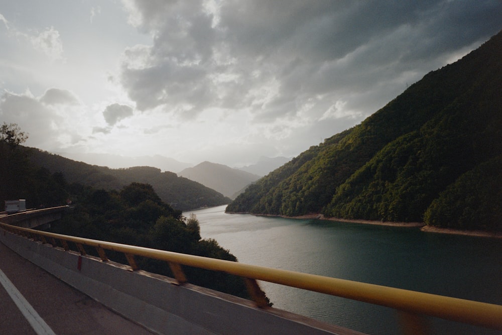 a view of a body of water with mountains in the background