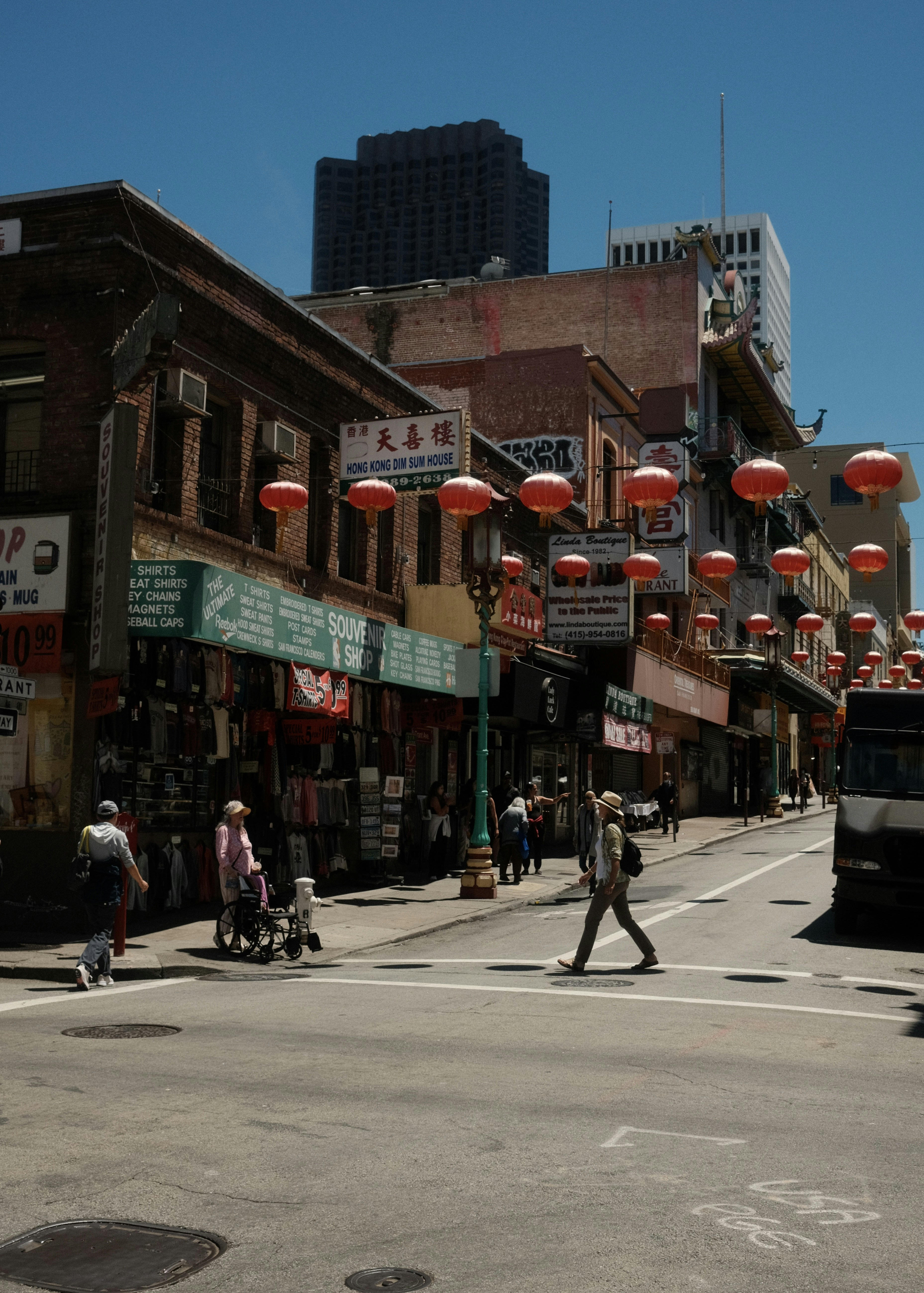 a busy city street with people crossing the street