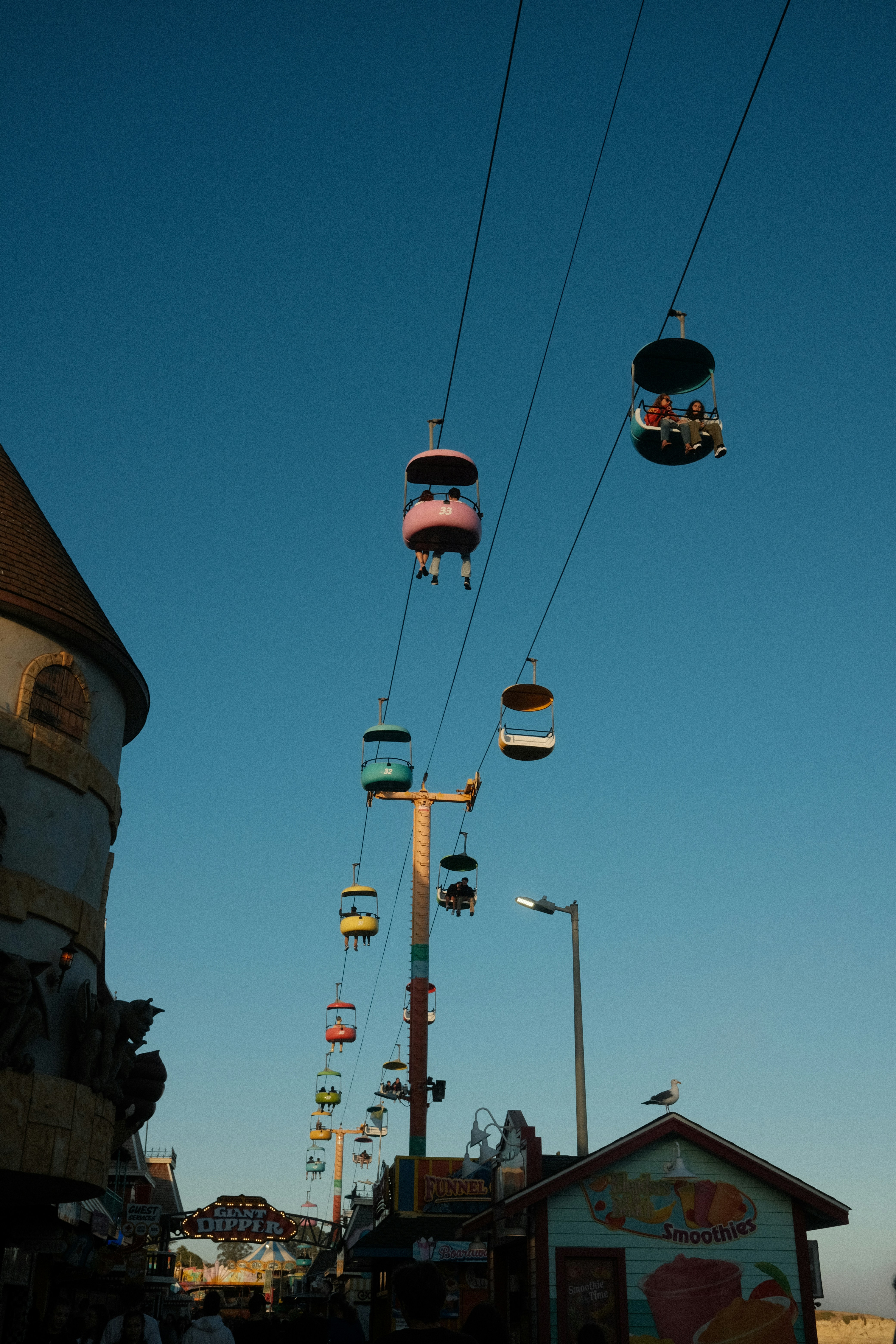 a group of people riding on top of a ski lift