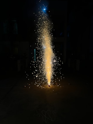 Close-up of sparkling fountains with golden sparks