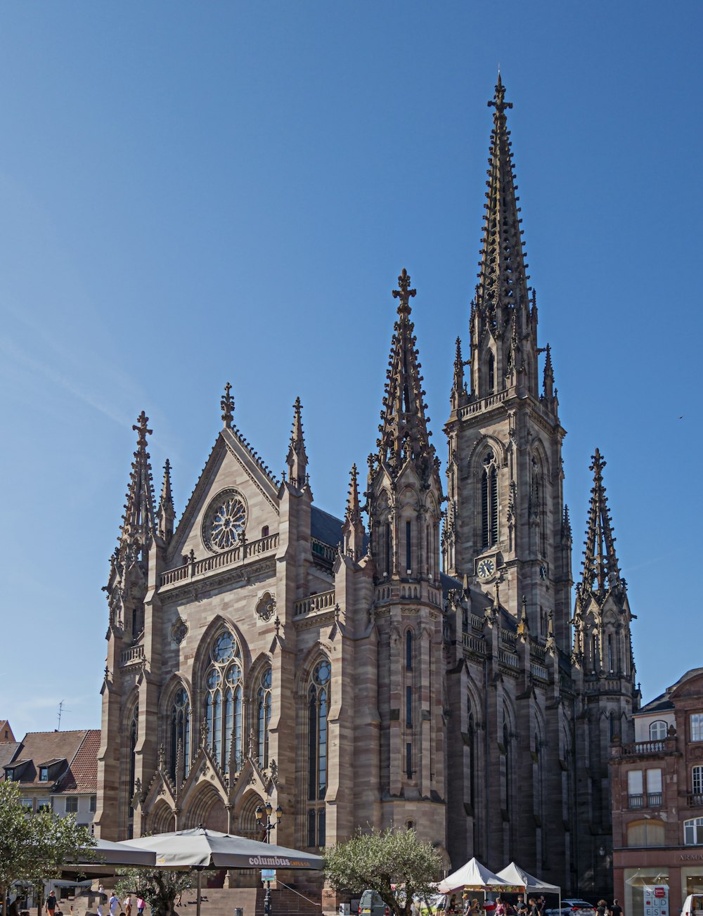 a large cathedral with a clock on it's side