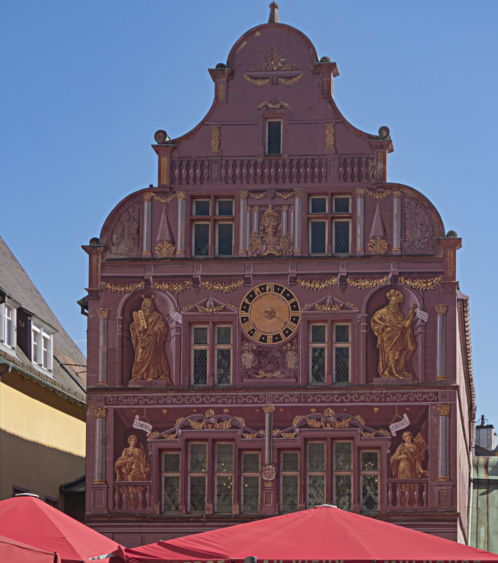 a tall building with a clock on the side of it