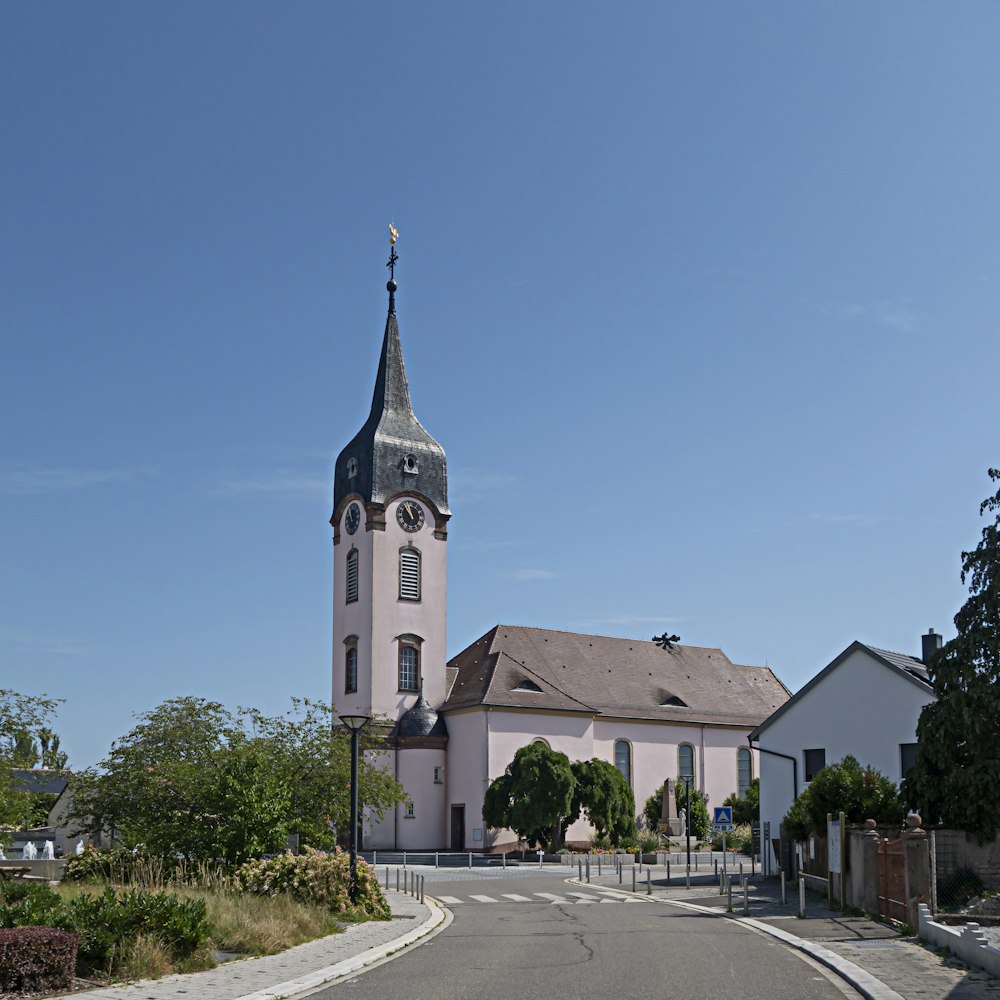 a church with a steeple on a clear day