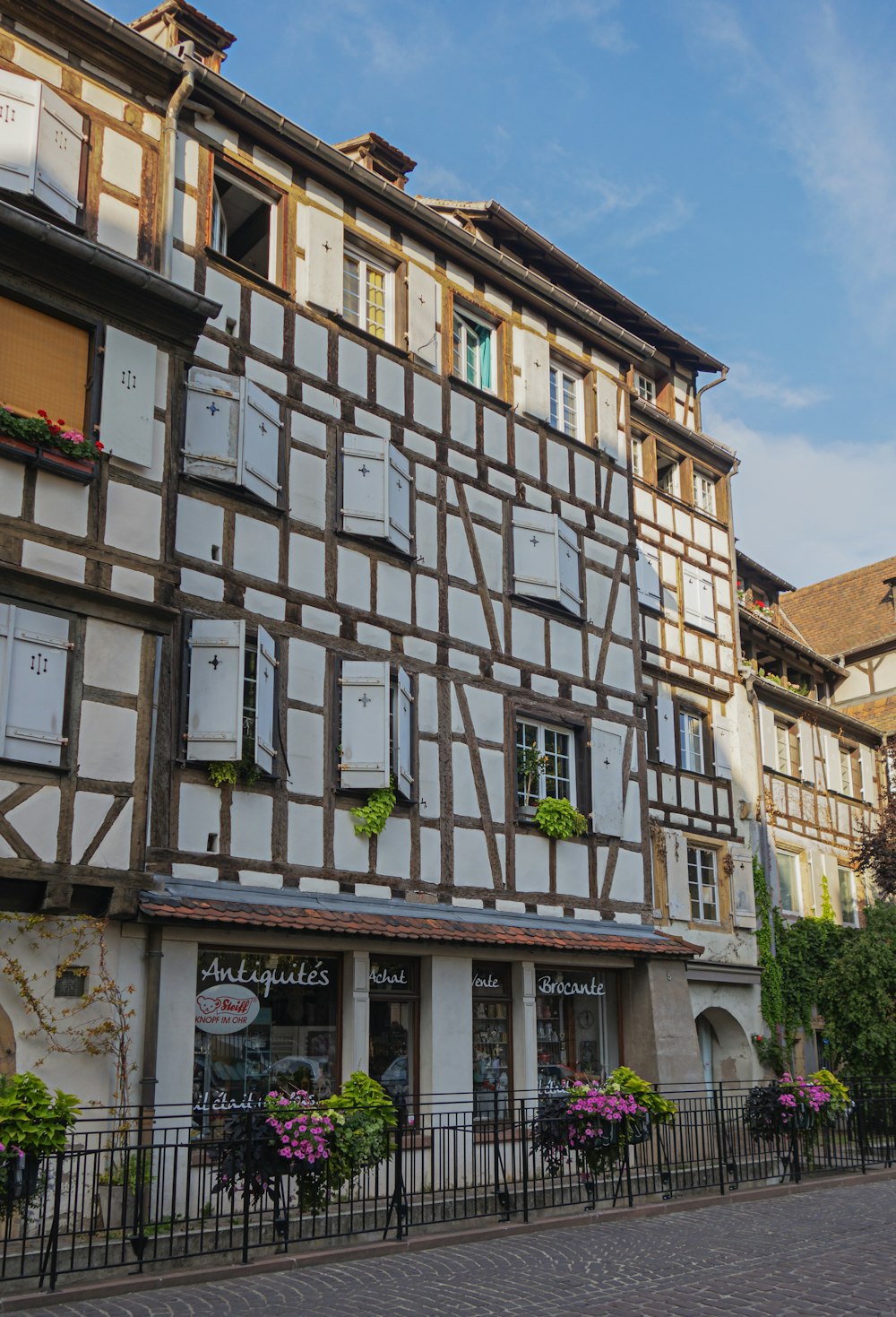 a building with a lot of windows and shutters