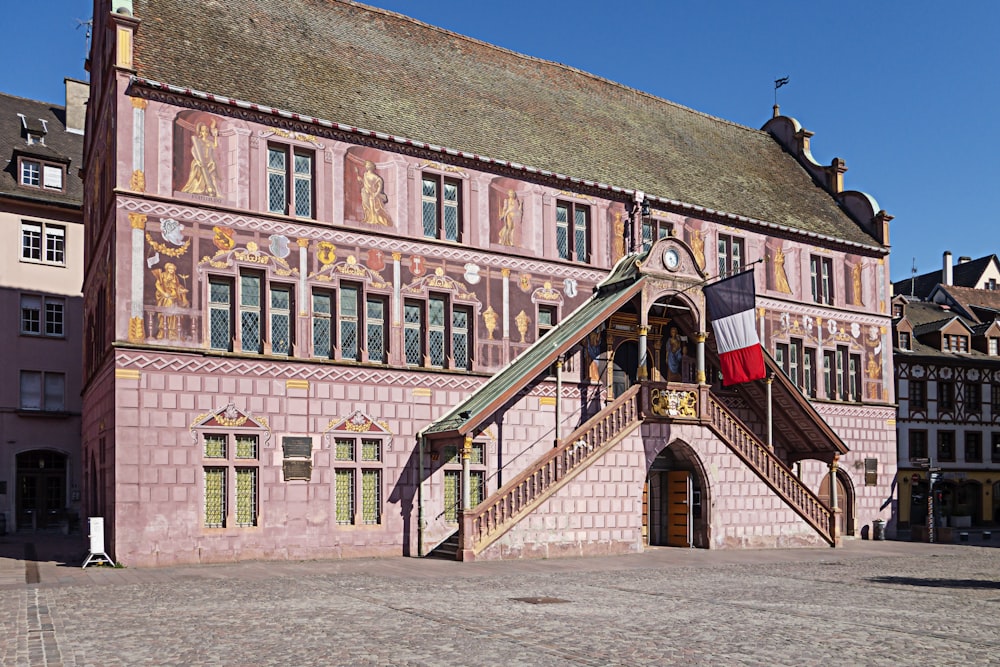 a large building with a flag on top of it