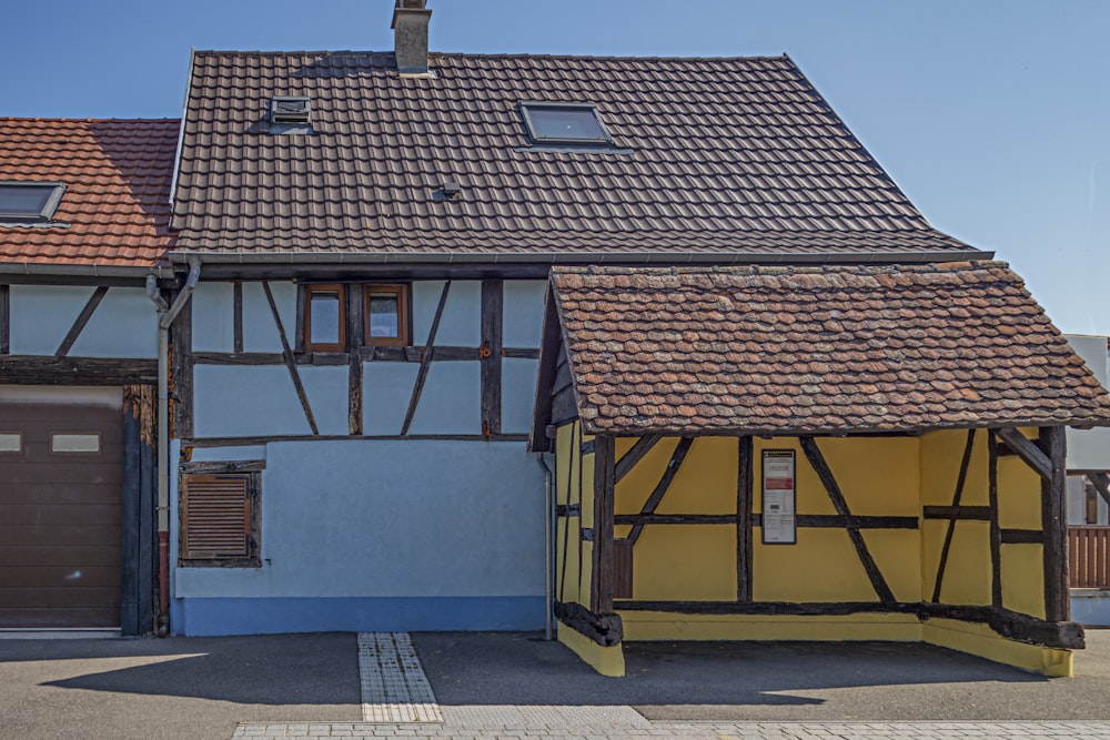 a building with a brown door and a brown roof