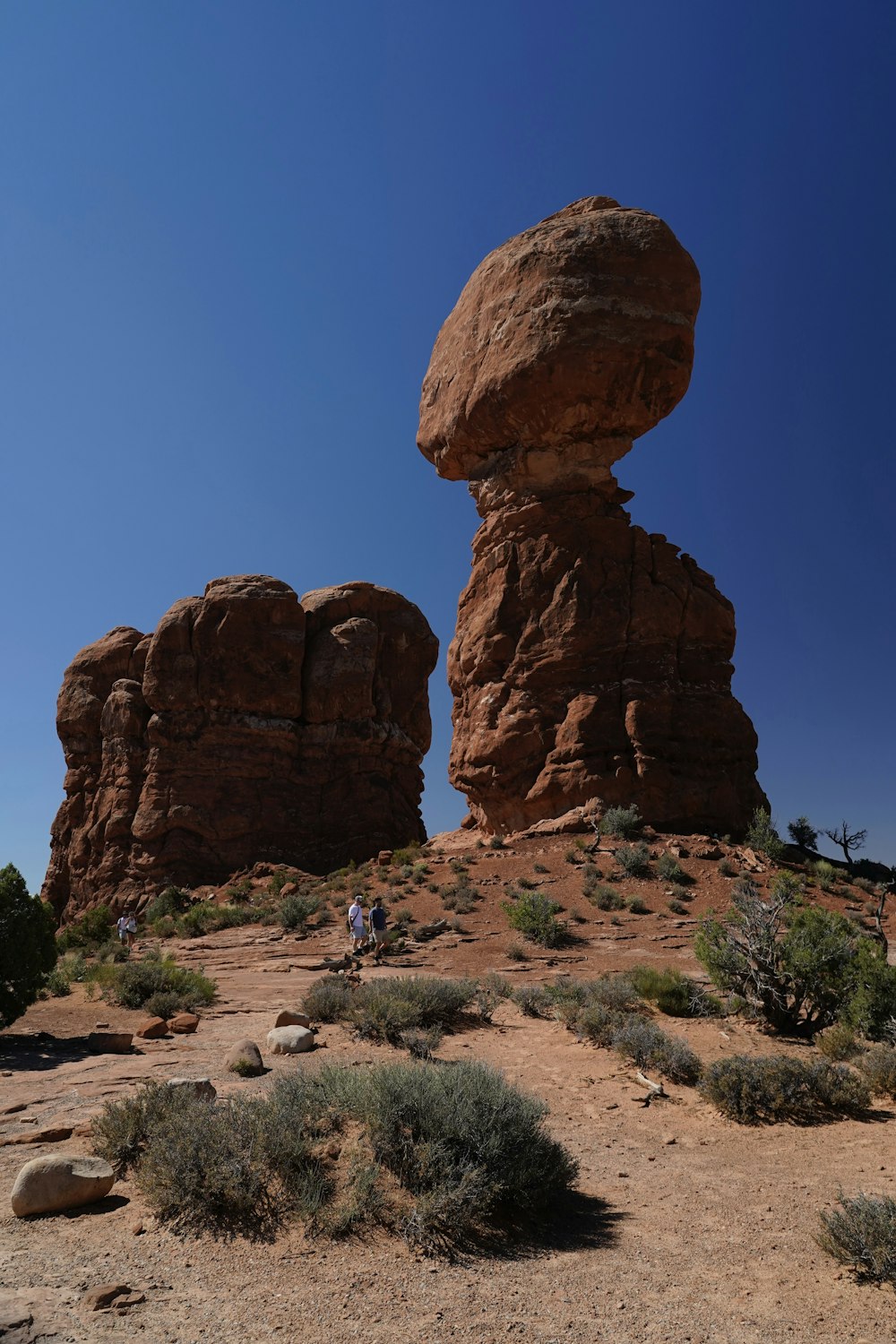 a large rock formation in the middle of a desert