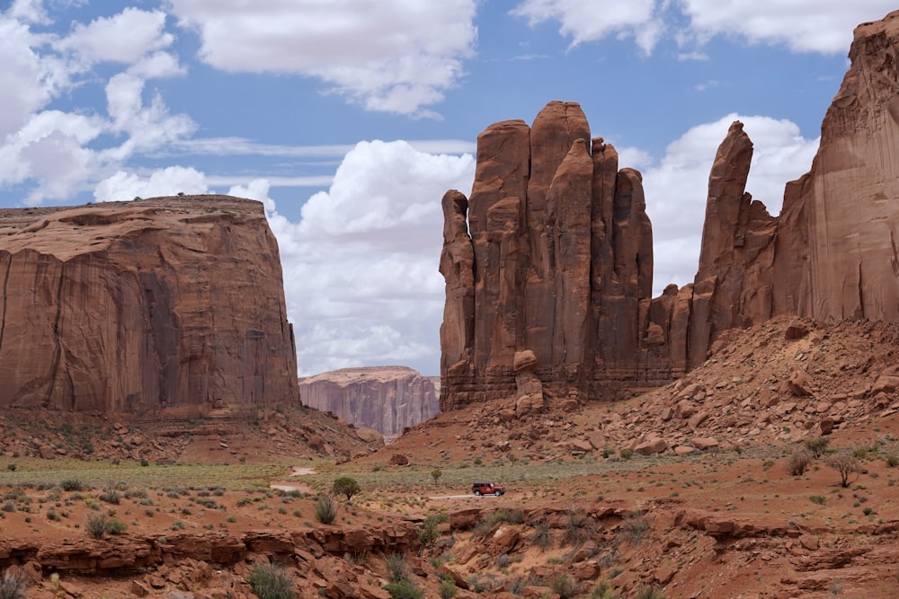 a desert landscape with rocks and a sky background