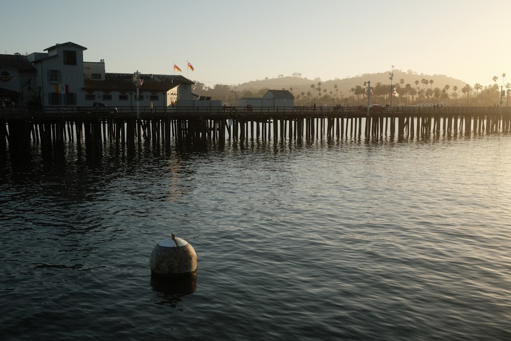 a large body of water next to a pier