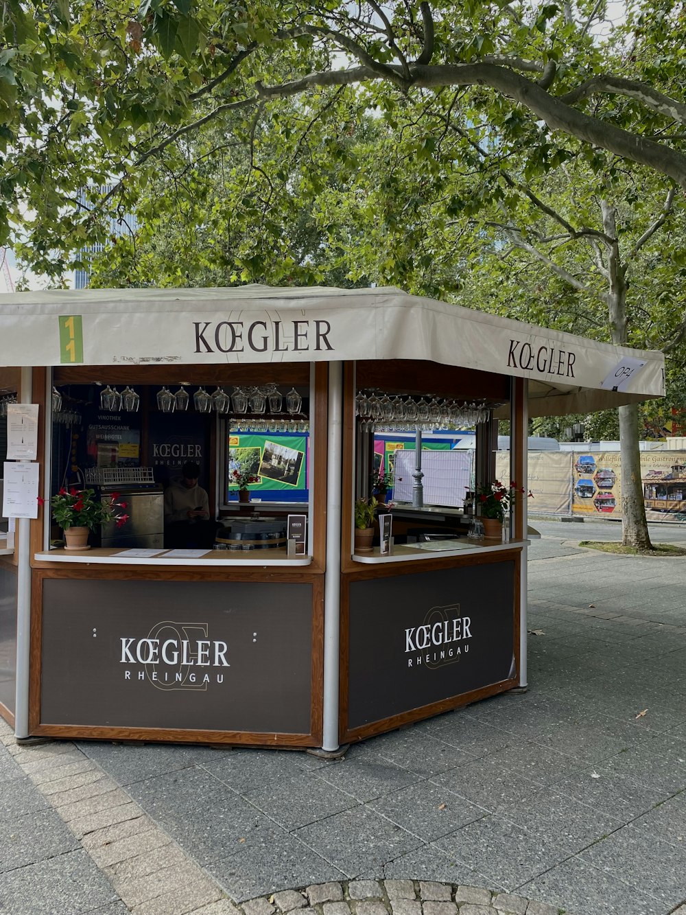 a small kiosk sitting on the side of a road