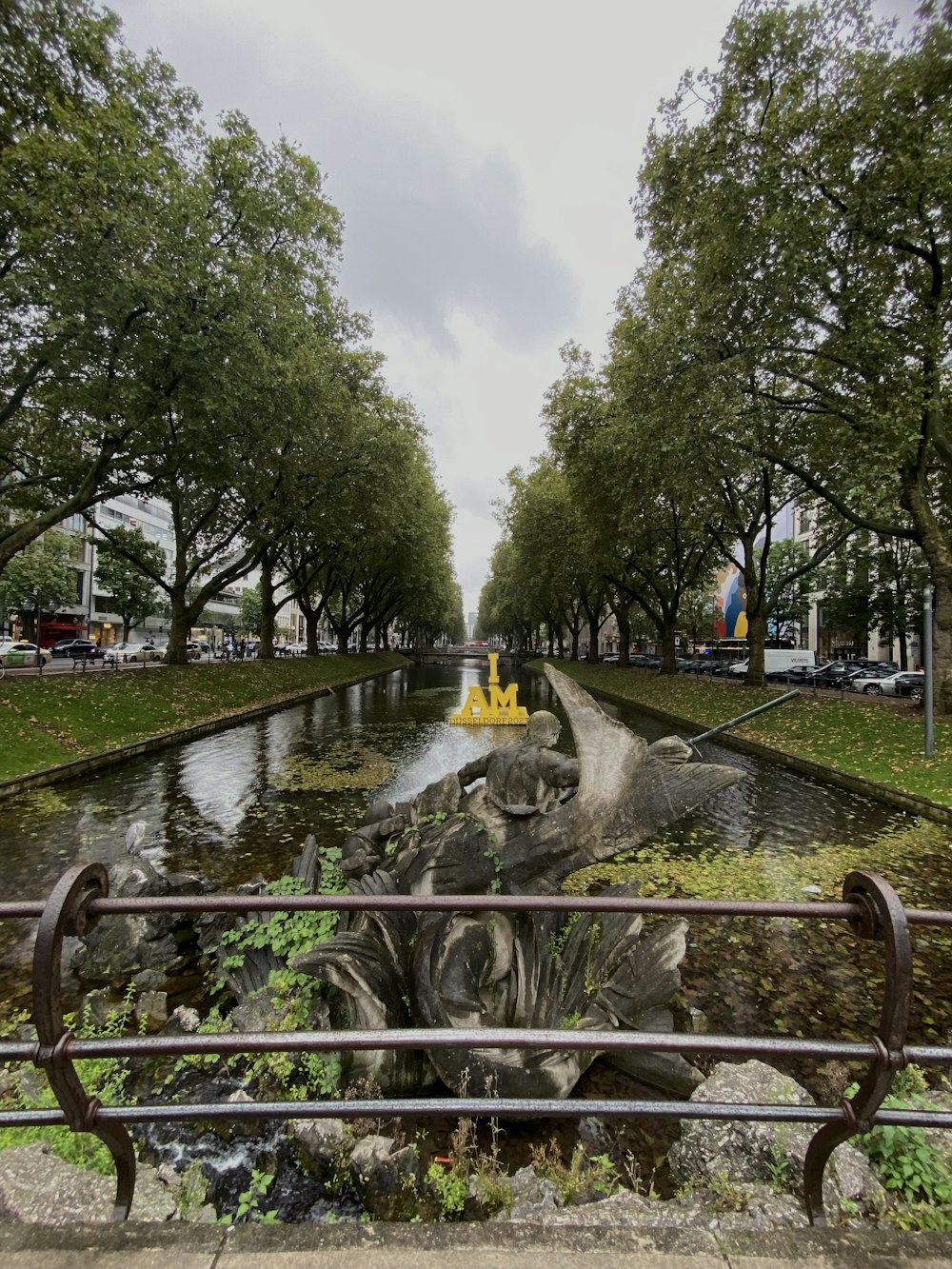 a statue of a man riding a horse in a canal