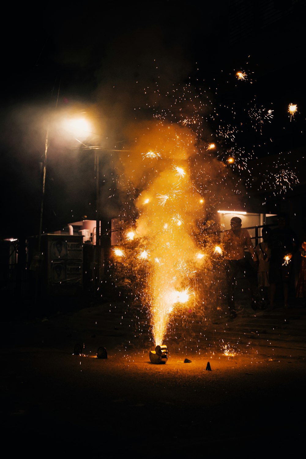 a group of people standing around a fire hydrant