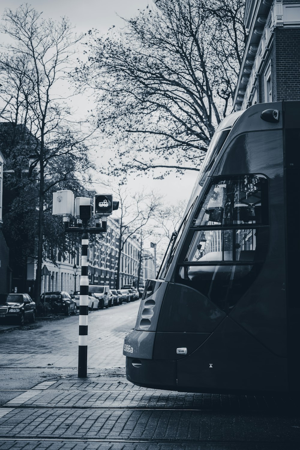 a black and white photo of a bus on a street