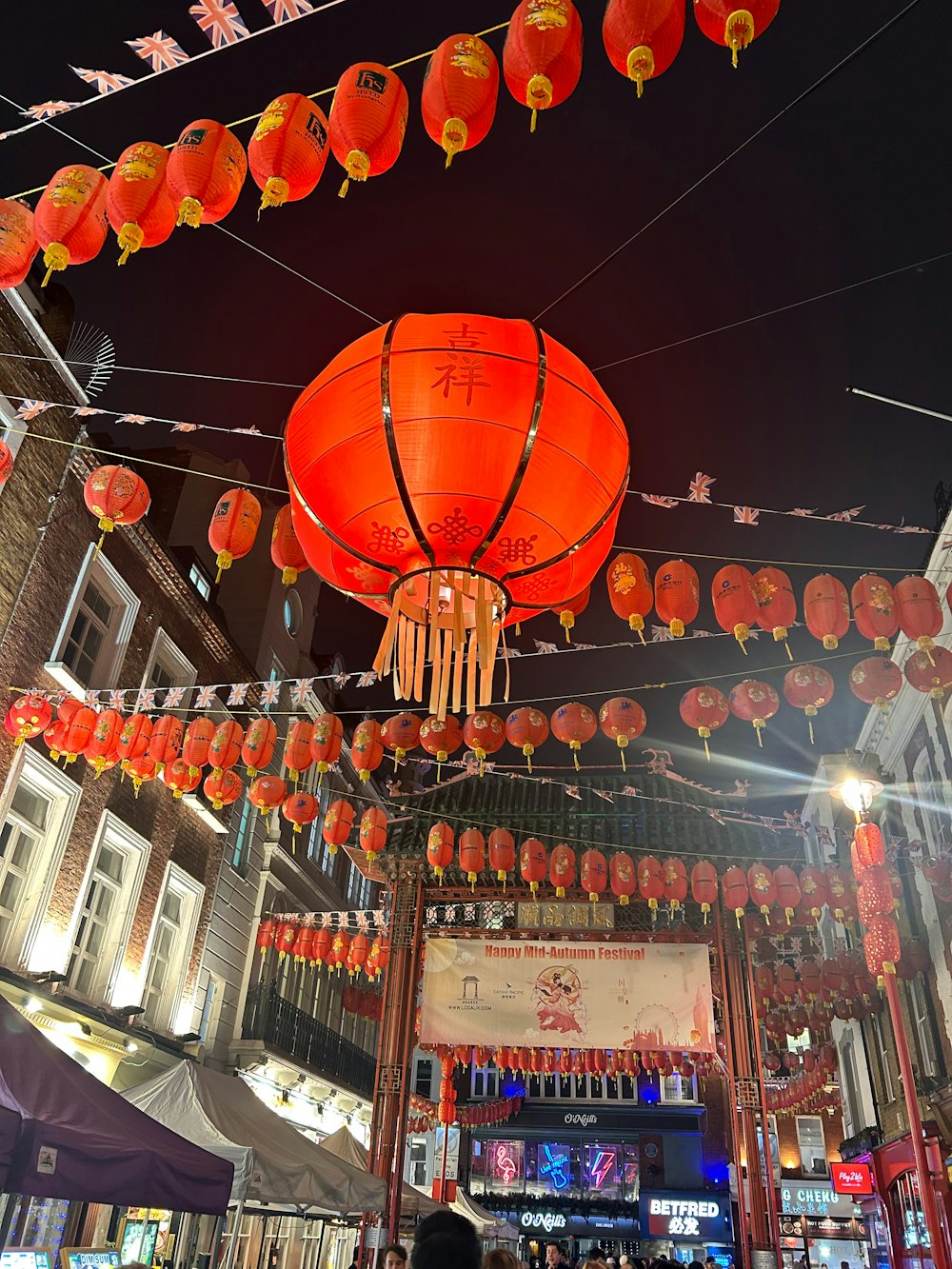 a group of red lanterns hanging from the ceiling