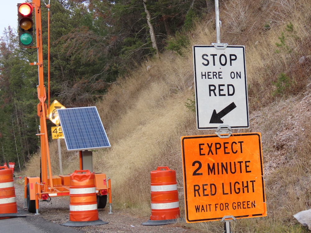 a traffic light with a solar panel on top of it