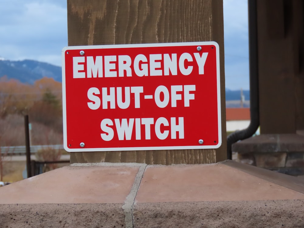 a red sign that says emergency shut - off switch