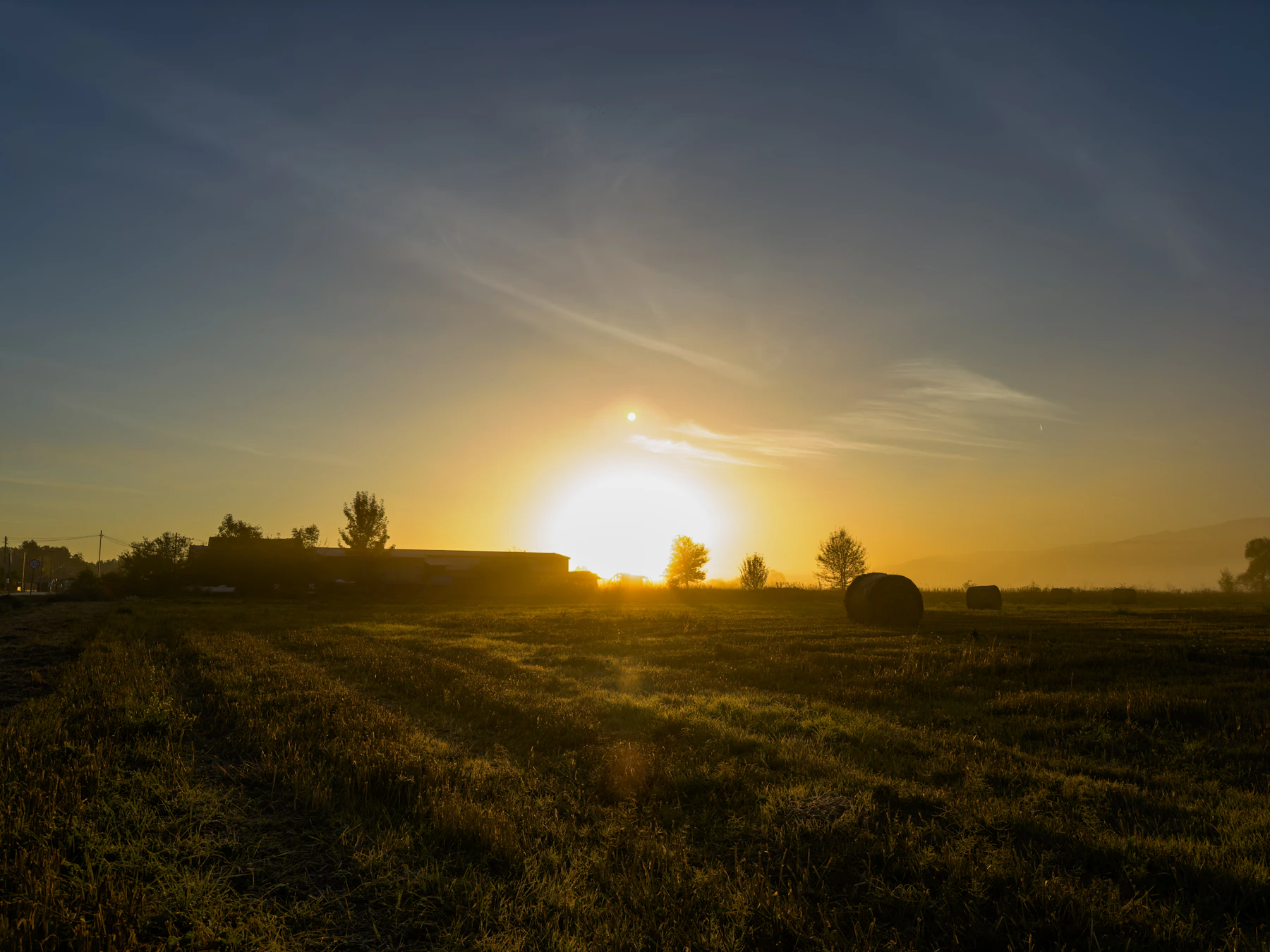 Golden hour over a farm field