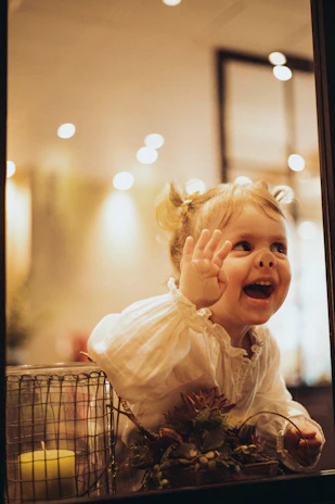 a little girl that is sitting in a basket