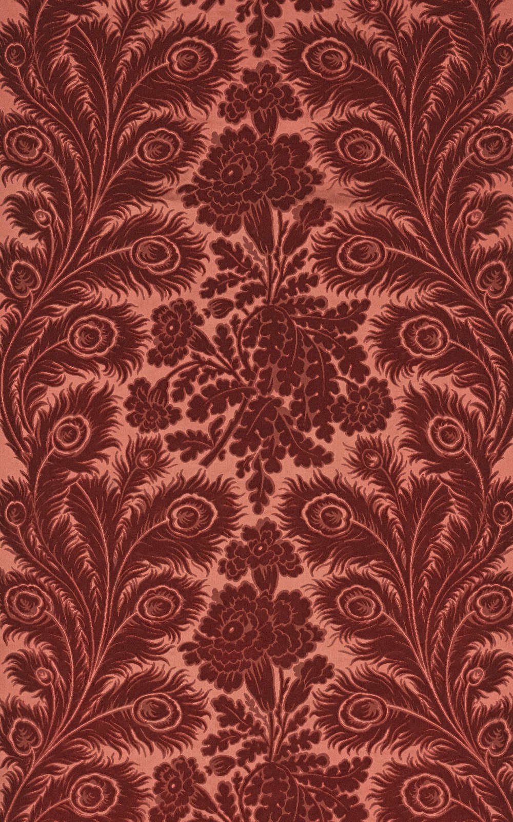 a red wallpaper with a floral design on it