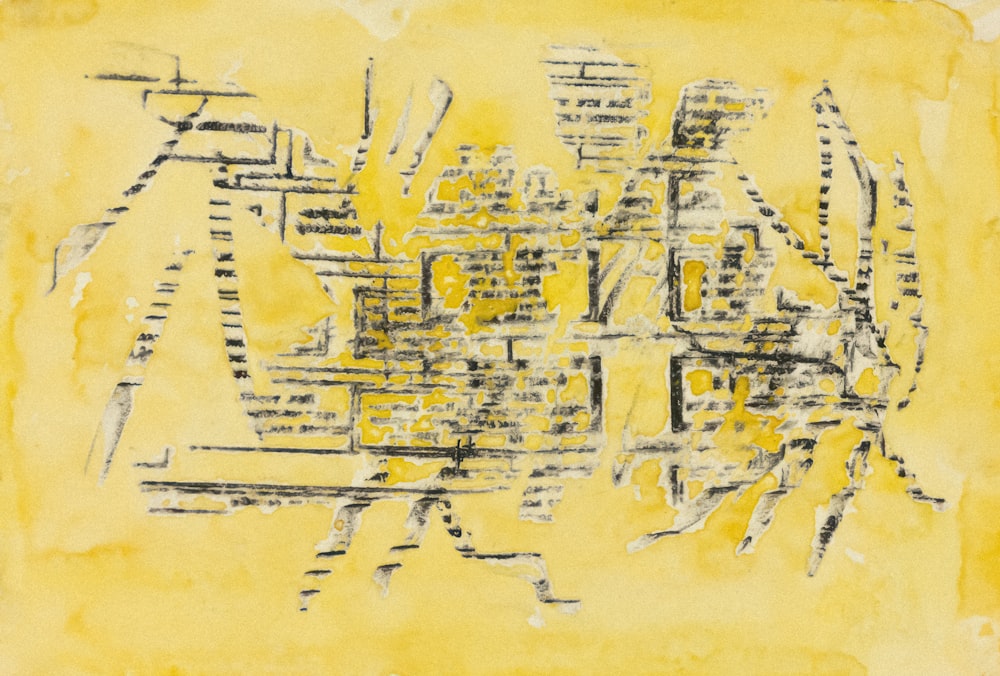 a yellow and black painting on a piece of paper