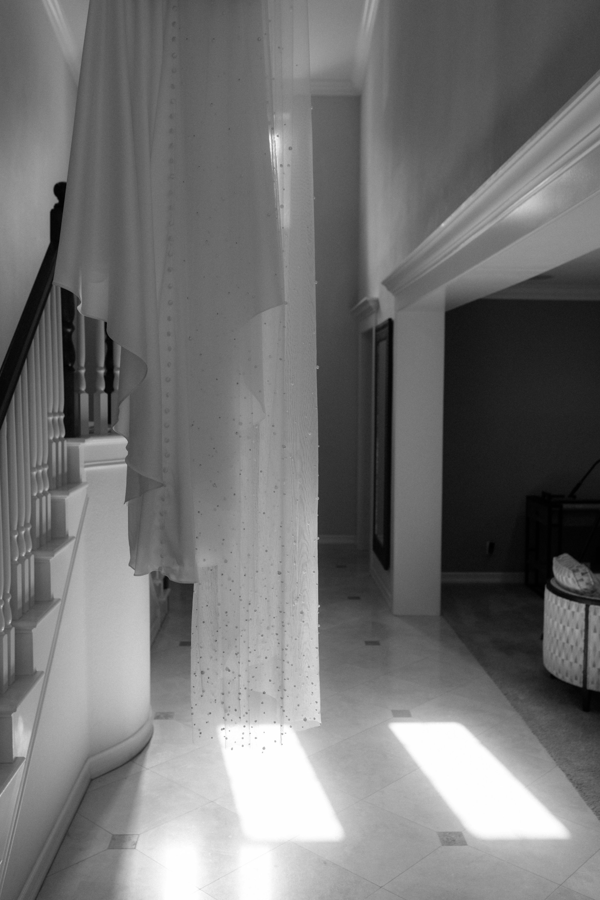 a black and white photo of a hallway