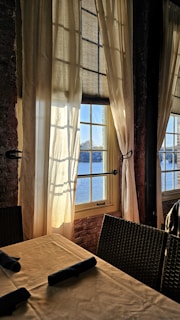 Sunlight streaming through large windows onto a group gathered for a weekend brunch at wkndr.