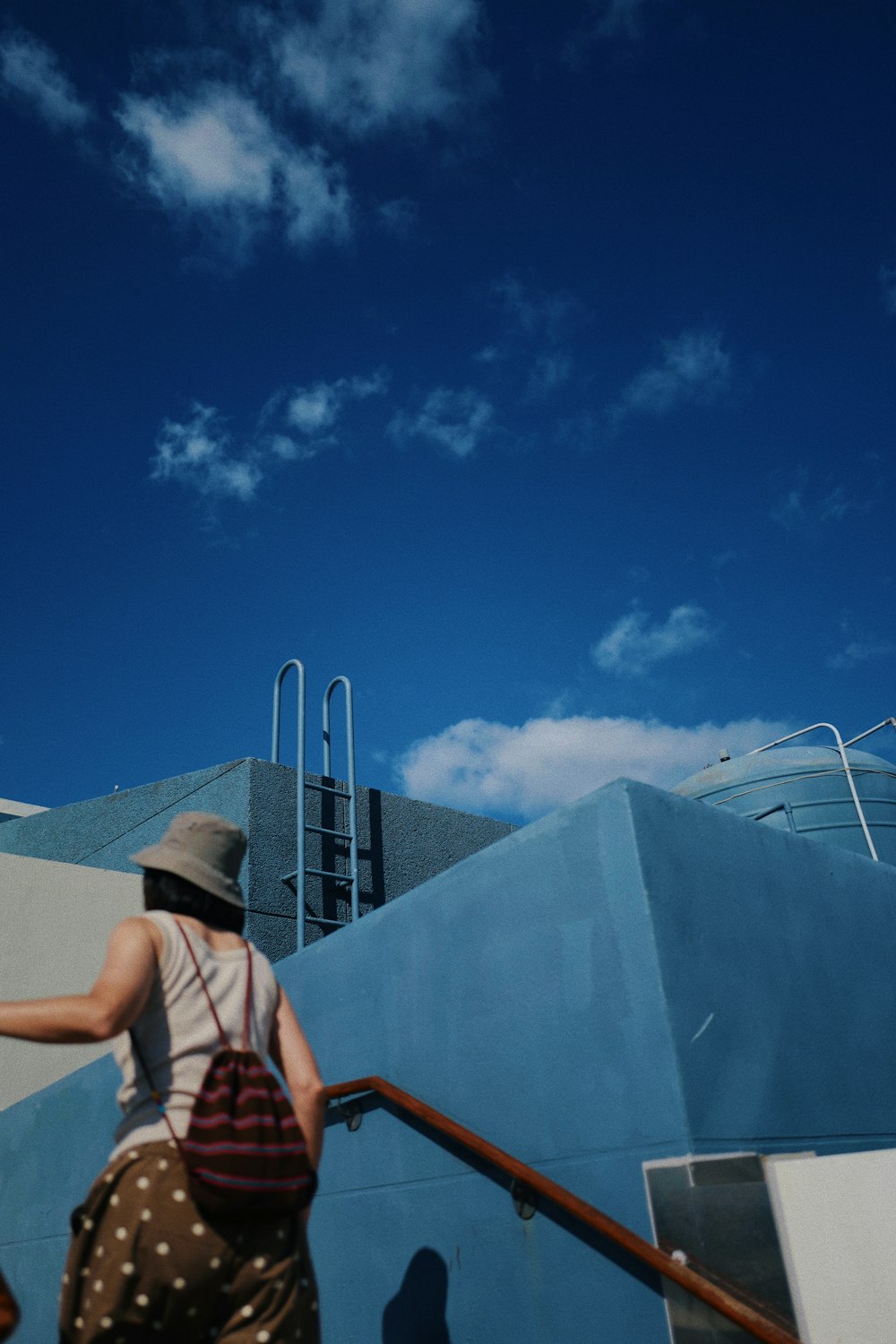 a woman walking up a flight of stairs