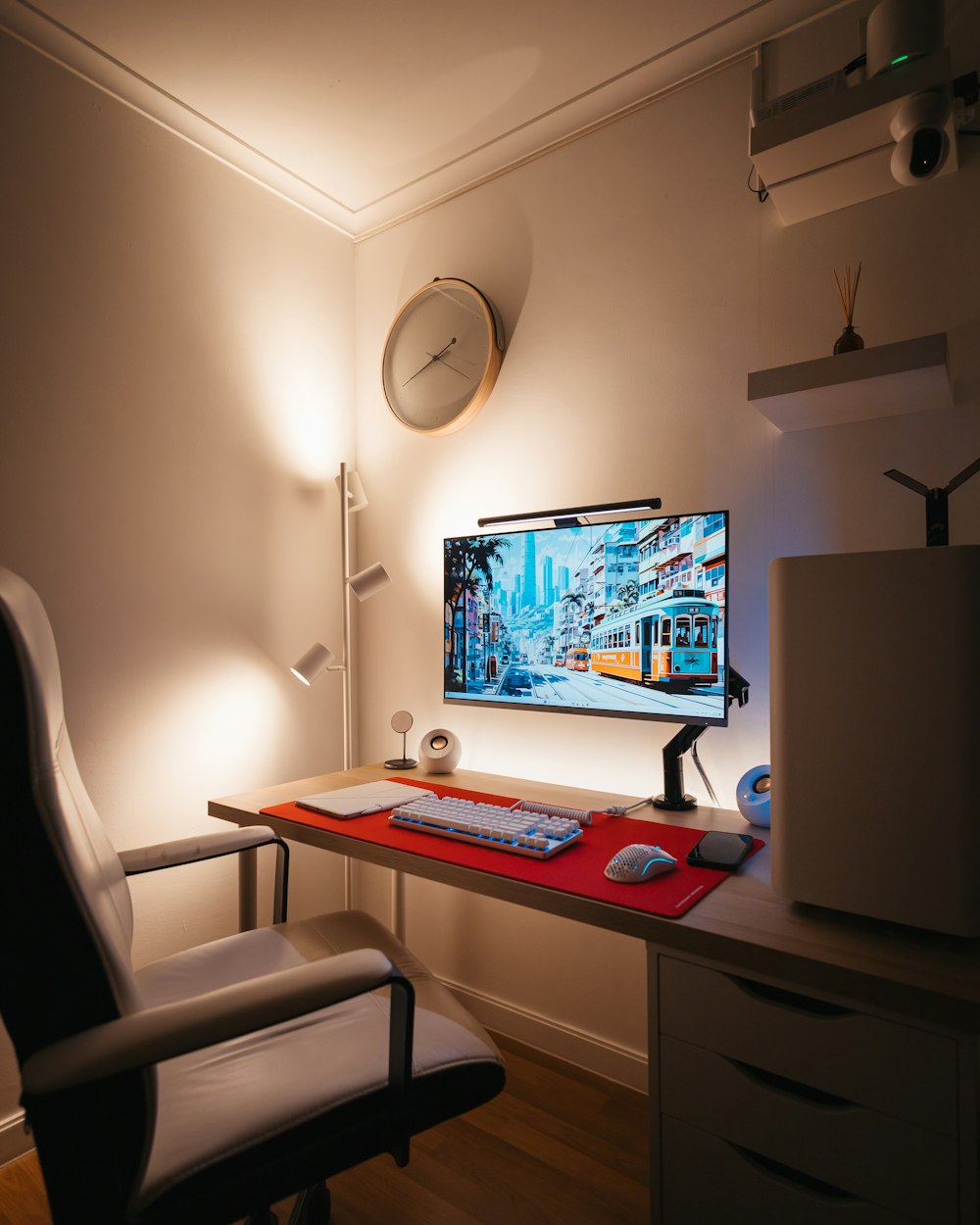 a computer desk with a monitor and keyboard on it