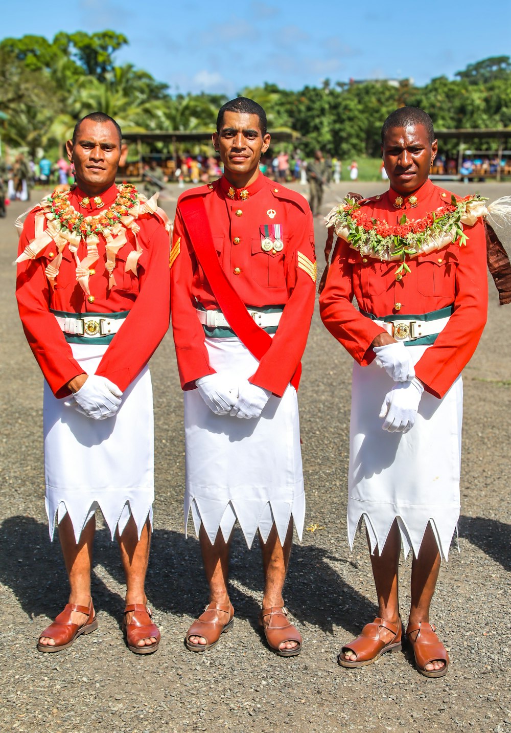three men dressed in red and white standing next to each other