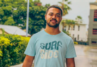 A customer wearing a custom-printed Blue Frost t-shirt outdoors in natural light.
