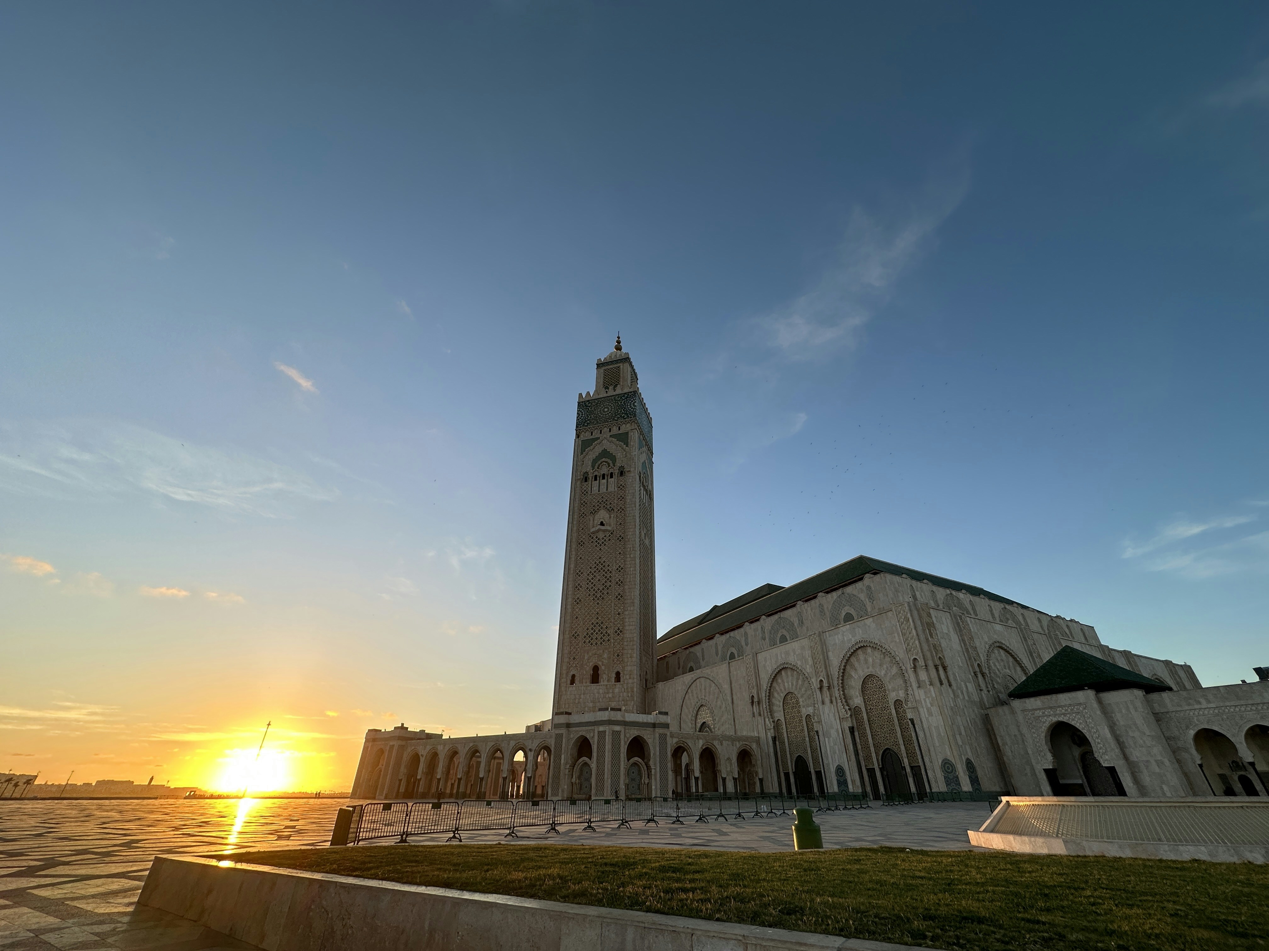 Hassan II Mosque Casablanca grand exterior dusk dramatic sky Atlantic ocean