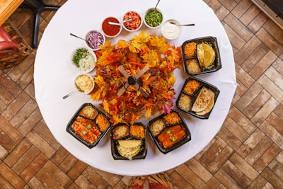 a white table topped with lots of food