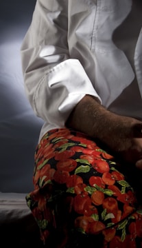 a close up of a person wearing a white shirt