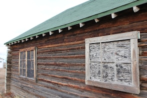 A durable security cabin with reinforced windows and weather-resistant exterior.