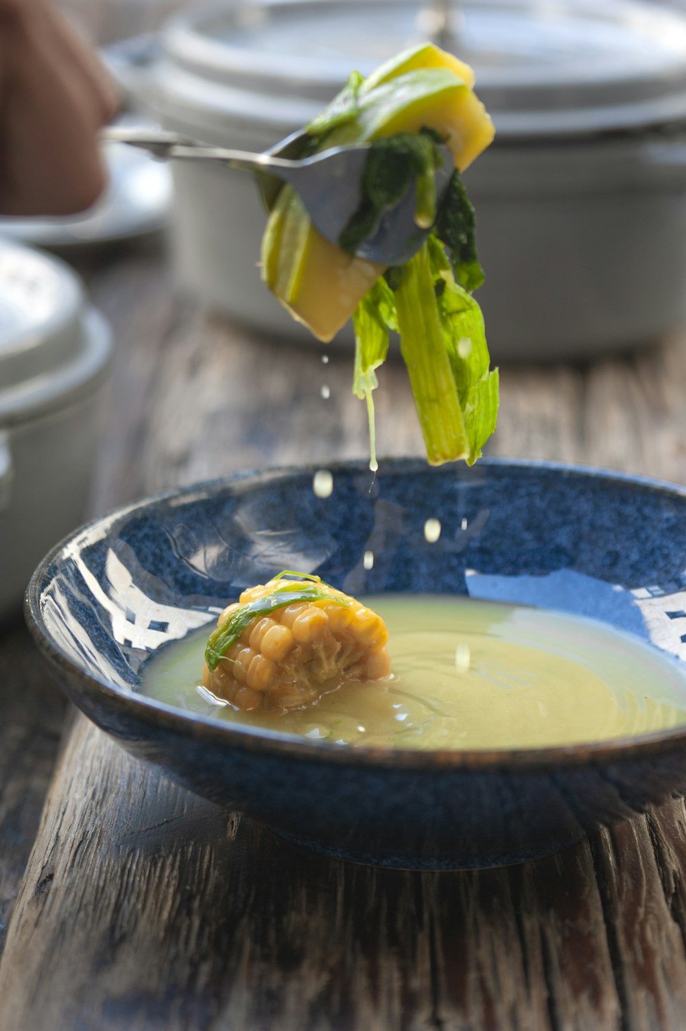 a bowl of soup with a spoon in it