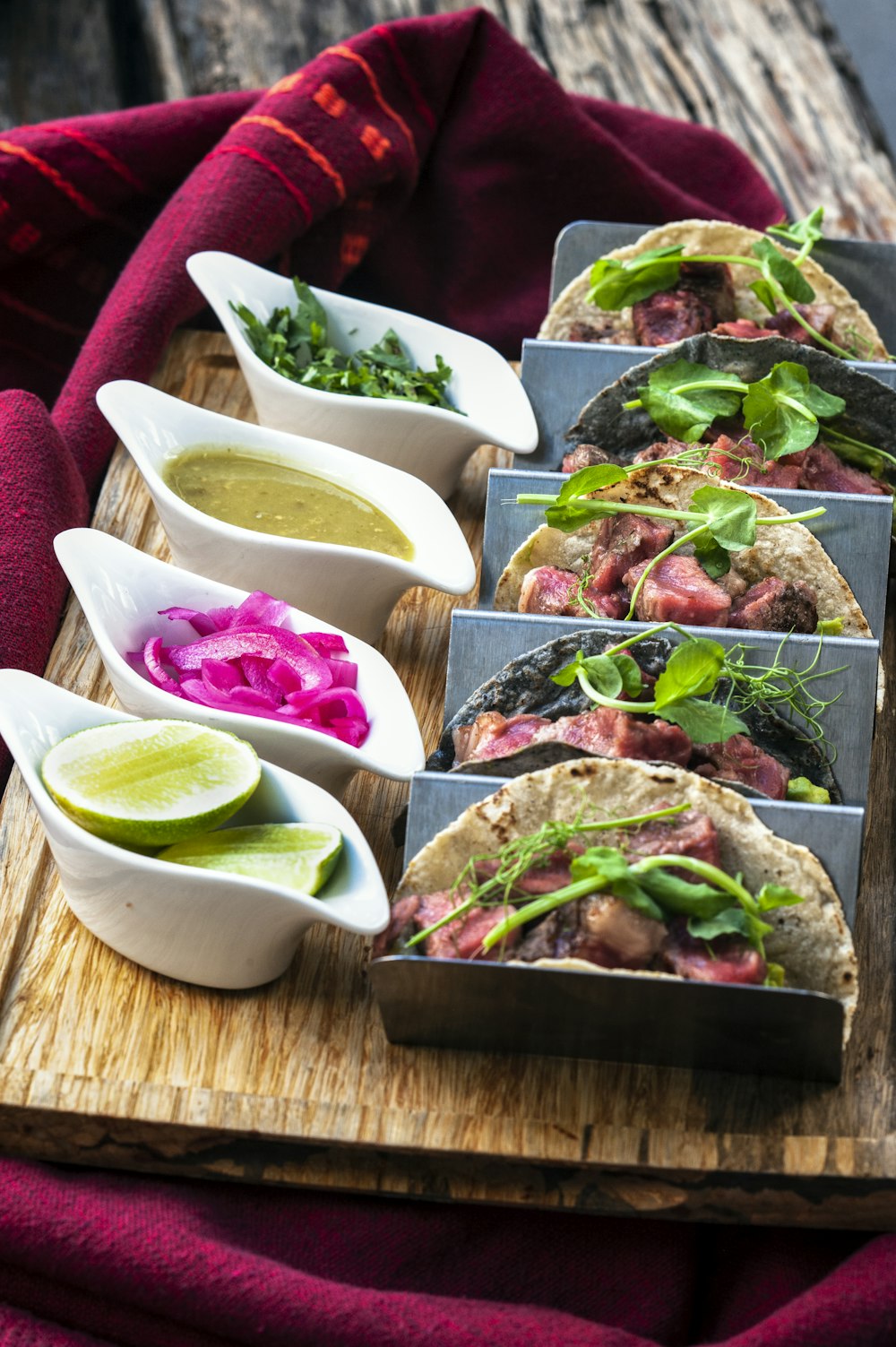 a wooden tray topped with different types of food