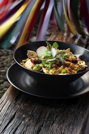 a plate of food on a wooden table
