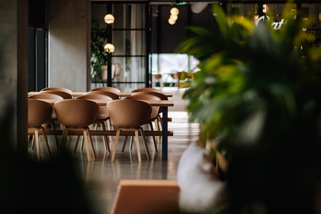Interior of the modern dining room with warm lighting and natural wood accents