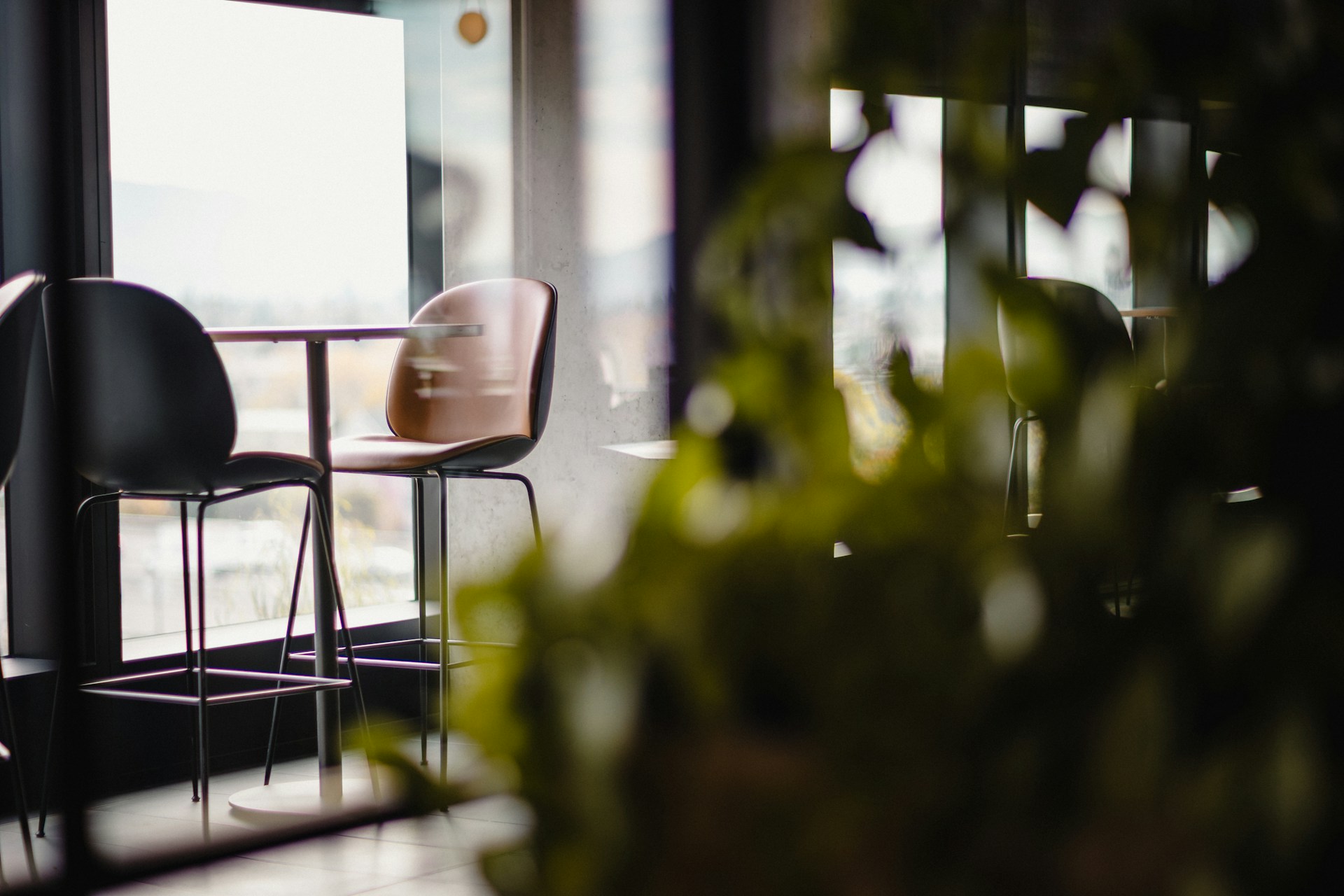 a couple of chairs sitting next to a window