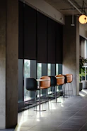 a row of chairs sitting in front of a window