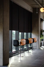 a row of chairs sitting in front of a window